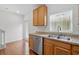 Kitchen featuring oak cabinets, laminate countertops and stainless steel dishwasher at 13329 Harbor Shore Ln, Winter Garden, FL 34787