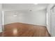 Bright, open living space featuring laminate floors and a modern pendant light at 13329 Harbor Shore Ln, Winter Garden, FL 34787