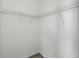 This walk-in closet includes sturdy wire shelving providing ample storage space for clothes, shoes and accessories at 13329 Harbor Shore Ln, Winter Garden, FL 34787