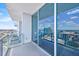 Inviting balcony with sliding glass doors offering panoramic city views and fresh air at 150 E Robinson St # 2408, Orlando, FL 32801