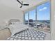 Bedroom with a large window view and soft carpet at 150 E Robinson St # 2408, Orlando, FL 32801