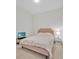 Simple bedroom with neutral decor, a comfortable bed, and a side table at 150 E Robinson St # 2408, Orlando, FL 32801