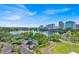 Breathtaking view of the city skyline and a serene lake with green spaces and recreational areas at 150 E Robinson St # 2408, Orlando, FL 32801