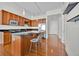 Efficient kitchen with an island, stainless steel appliances, and hardwood floors at 150 E Robinson St # 2408, Orlando, FL 32801