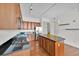 Well-equipped kitchen with island, stainless steel appliances, and dark granite countertops at 150 E Robinson St # 2408, Orlando, FL 32801