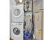 Convenient laundry area with stackable washer and dryer, plus utility sink and storage at 150 E Robinson St # 2408, Orlando, FL 32801