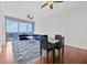 Bright living room with hardwood floors, ceiling fans, floor to ceiling windows, and comfortable seating at 150 E Robinson St # 2408, Orlando, FL 32801