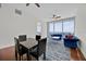 Bright living room with hardwood floors, floor to ceiling windows, and comfortable seating at 150 E Robinson St # 2408, Orlando, FL 32801