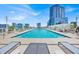 Rooftop swimming pool with inviting lounge chairs and stunning views of the surrounding cityscape at 150 E Robinson St # 2408, Orlando, FL 32801
