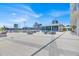Spacious rooftop terrace equipped with comfortable seating areas, tables, and lush greenery at 150 E Robinson St # 2408, Orlando, FL 32801