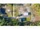 Aerial view of the home, shop, and the surrounding lush landscape at 1555 Seminole Run Rd, Osteen, FL 32764