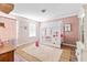 Charming bedroom featuring a playful house-shaped bed frame and neutral tones at 1555 Seminole Run Rd, Osteen, FL 32764