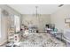 Versatile bonus room with a chandelier and ample space for various activities and play at 1555 Seminole Run Rd, Osteen, FL 32764