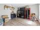 Spacious bonus room featuring ample storage, unique decor, and wood-look flooring at 1555 Seminole Run Rd, Osteen, FL 32764