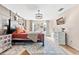 The main bedroom has wood floors, a large bed, an accent wall and a full dresser at 1555 Seminole Run Rd, Osteen, FL 32764