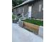 The back entrance has a white door with stone-like additions on a simple yet stylish design at 1611 Creekwood Run, Lakeland, FL 33809