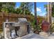 Backyard grilling station with a stainless steel grill and built in counter top and grill smoker at 1611 Creekwood Run, Lakeland, FL 33809
