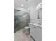 Modern bathroom featuring a glass enclosed shower with marble style tiling and a white vanity at 1611 Creekwood Run, Lakeland, FL 33809