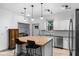 Well-lit kitchen with stainless steel appliances and center island with seating at 1611 Creekwood Run, Lakeland, FL 33809