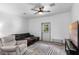 Cozy living room featuring a comfortable sofa, recliner, and a view of the outdoors at 1611 Creekwood Run, Lakeland, FL 33809