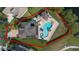 Captivating aerial perspective of the property, highlighting the exquisite pool and outdoor living space at 1710 Bridgets Ct, Kissimmee, FL 34744