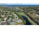 Breathtaking aerial view of the house, nestled amidst a picturesque landscape with a pond at 1710 Bridgets Ct, Kissimmee, FL 34744