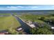 Aerial view showcasing the property's canal access, boat dock, and proximity to open water at 1710 Bridgets Ct, Kissimmee, FL 34744