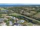 Scenic aerial shot overlooking the property, showcasing the beautiful lake and verdant surroundings at 1710 Bridgets Ct, Kissimmee, FL 34744
