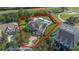 Gorgeous aerial shot of the home and its surroundings, with manicured landscaping and mature trees at 1710 Bridgets Ct, Kissimmee, FL 34744