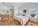 Bright bedroom with updated flooring, decor, and natural light; creating a comfortable retreat at 1710 Bridgets Ct, Kissimmee, FL 34744