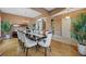 Spacious dining room with hardwood floors, decorative arches and access to living area at 1710 Bridgets Ct, Kissimmee, FL 34744