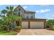 Charming two-story home with a three car garage and beautiful stone and brick facade at 1710 Bridgets Ct, Kissimmee, FL 34744