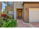 Charming home exterior with brick and stone facade, inviting front door, and lovely landscaping at 1710 Bridgets Ct, Kissimmee, FL 34744