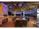A gazebo with a brick fireplace, outdoor seating, a bar, and lights with a pool view at 1710 Bridgets Ct, Kissimmee, FL 34744