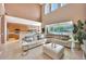 Open concept living area with high ceilings, tile floors and view of the pool at 1710 Bridgets Ct, Kissimmee, FL 34744