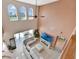 Spacious living room with soaring ceilings, a ceiling fan, and a view of the large windows at 1710 Bridgets Ct, Kissimmee, FL 34744