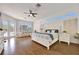 Spacious main bedroom features a seating area, hardwood floors, and access to the pool at 1710 Bridgets Ct, Kissimmee, FL 34744