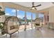 Sunroom with casual seating offers access to outdoor patio and pool at 1710 Bridgets Ct, Kissimmee, FL 34744