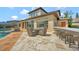 A patio with outdoor dining and bar area, overlooking pool and golf course at 1710 Bridgets Ct, Kissimmee, FL 34744