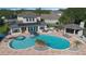 An inviting backyard with a large pool, spa, cabana, and outdoor kitchen perfect for entertaining at 1710 Bridgets Ct, Kissimmee, FL 34744