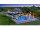 Inviting backyard with a large pool, spa, cabana, and outdoor kitchen perfect for twilight entertaining at 1710 Bridgets Ct, Kissimmee, FL 34744