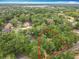 Aerial view of wooded property and charming home showcases location at 1869 Eagles Rest Dr, Apopka, FL 32712