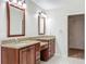 Bathroom featuring double vanity, granite countertops, tile floors and walk-in closet at 1869 Eagles Rest Dr, Apopka, FL 32712