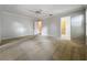 Spacious bedroom with neutral carpet, ceiling fan, and ensuite bathroom access at 1869 Eagles Rest Dr, Apopka, FL 32712