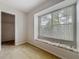 This bedroom features a sunny window seat and neutral walls at 1869 Eagles Rest Dr, Apopka, FL 32712