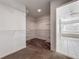 Walk-in closet with carpet, shelving and hanging racks; bathroom in background at 1869 Eagles Rest Dr, Apopka, FL 32712