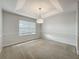 Dining area with window and tray ceiling at 1869 Eagles Rest Dr, Apopka, FL 32712