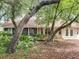 Charming home surrounded by mature trees, offering privacy and a serene setting at 1869 Eagles Rest Dr, Apopka, FL 32712