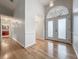 Entryway with hardwood floors and a decorative front door at 1869 Eagles Rest Dr, Apopka, FL 32712