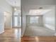 Inviting foyer with hardwood floors and a view into the dining room at 1869 Eagles Rest Dr, Apopka, FL 32712